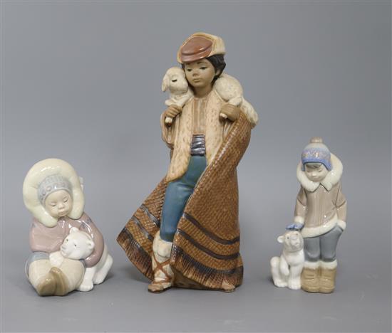 Three Lladro figures: shepherd boy and two Eskimo children with bears tallest 24cm